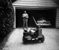 Jim Walker shows his Radio Controlled Lawnmower to the Newsreel cameras.