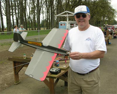 Merl Hoem holds his Foamy Firecat, a radio controlled plane of his own design