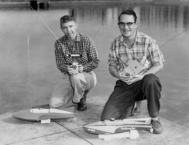Willie Willingham and Chuck Hein with Miss Thriftway and Miss Thriftway Too, boats by American Junior. Photo was taken around 1957 at the Westmoreland Casting Pond in Portland, Oregon